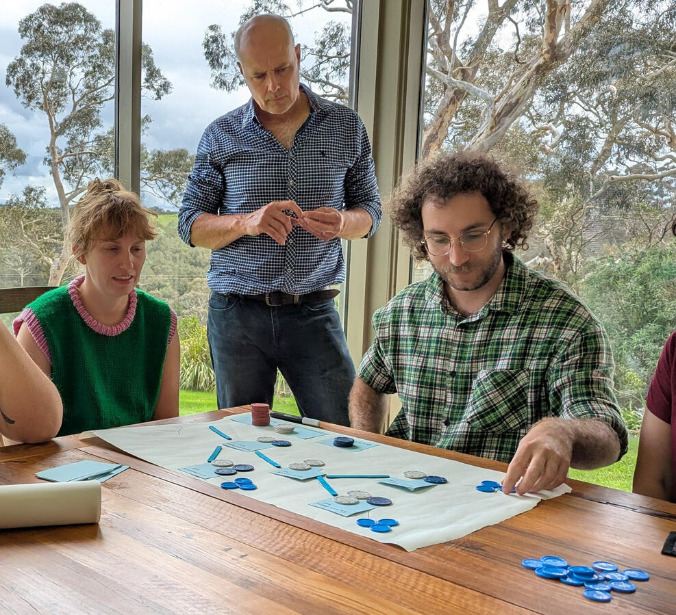 Game prototype that illustrates water flow, connectivity, and community decision-making.